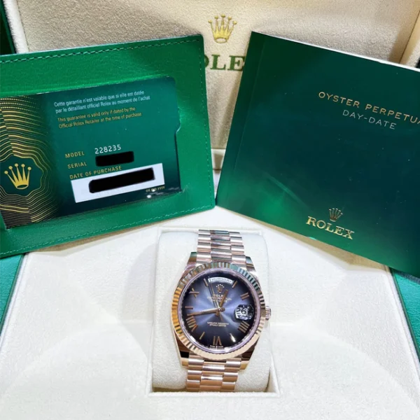 Rolex Day-Date 40 Slate Ombré Roman Dial Everose Gold 228235 watch on a box