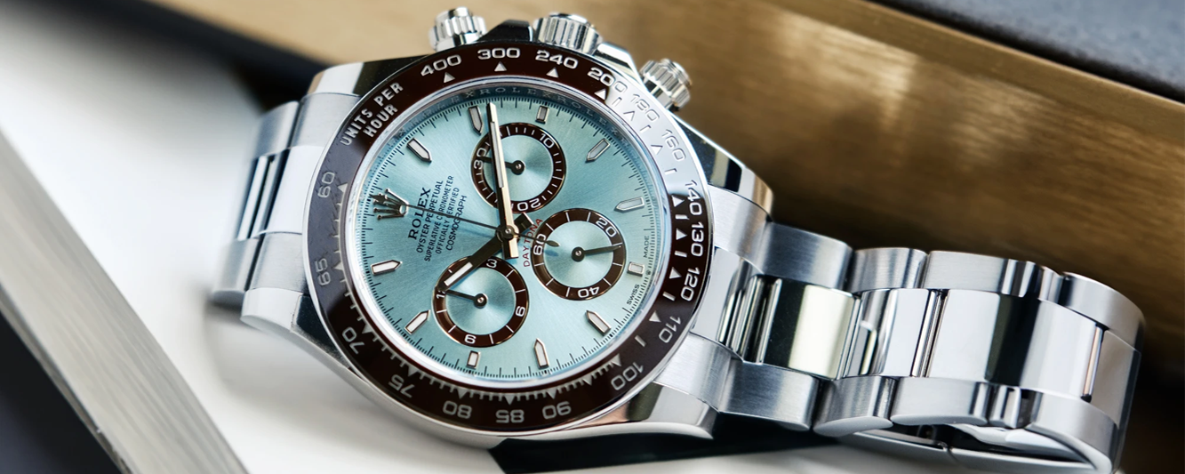 rolex platinum daytona ice blue dial 126506 in the rolex box on a magazine