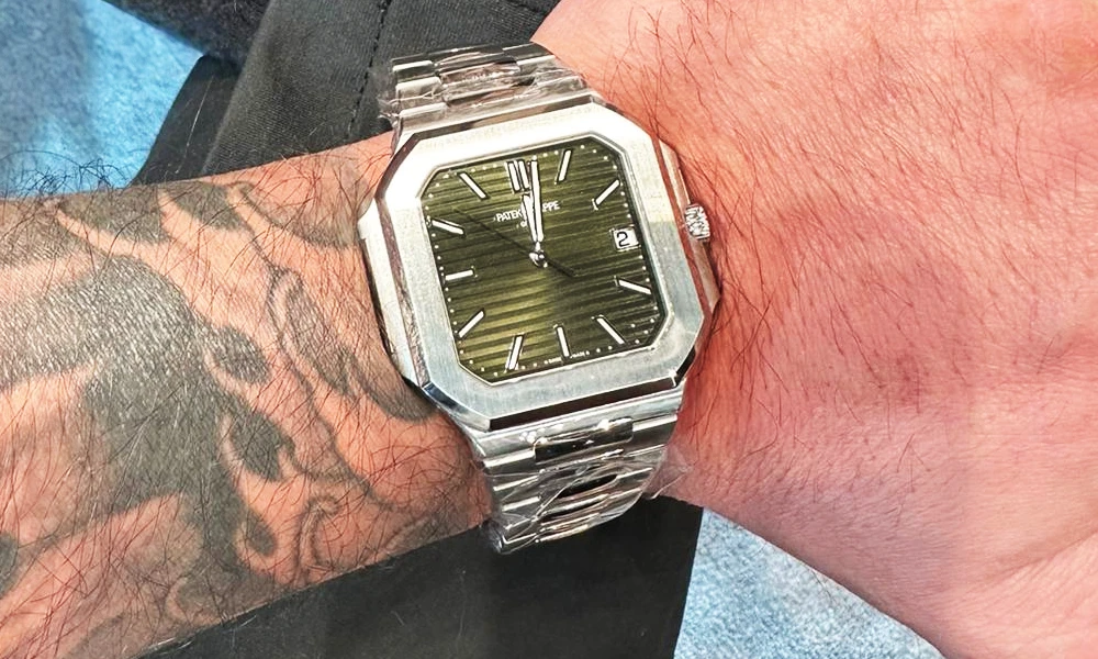 Patek Philippe Cubitus Stainless Steel with Sunburst Olive Green Dial 5821-1A-001 Watch on hand