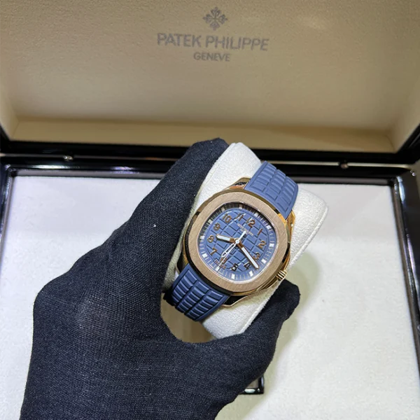 2024 Patek Philippe Aquanaut Travel Time NEW RELEASE Opaline Blue and Gray Dial 38.8mm Rose Gold 5269R-001 - Holding watch