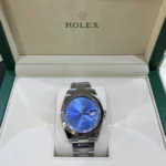 Rolex Datejust 41 Blue Roman Dial Fluted Bezel Oysteelsteel & White Gold Oyster 126334 - Front view in the box