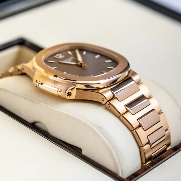 Left - Patek Philippe Nautilus 7118 1R Rose Gold Champagne Lady